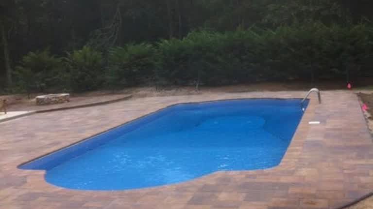 Completed paver surround around an in-ground pool